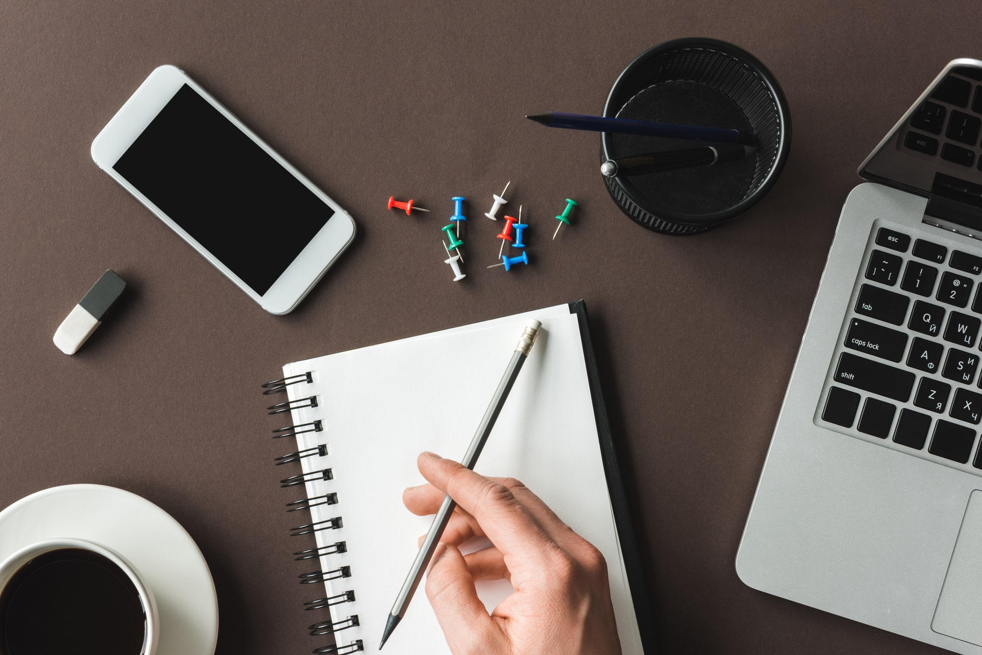 Pencil and pad at desk