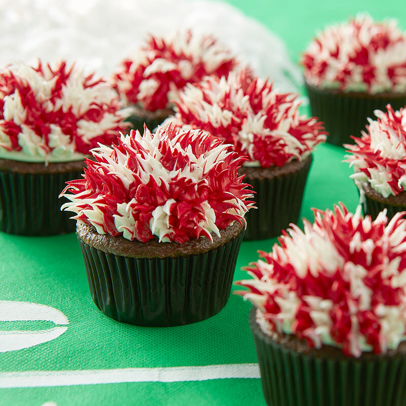 Cupcakes with red & white pom pom topper
