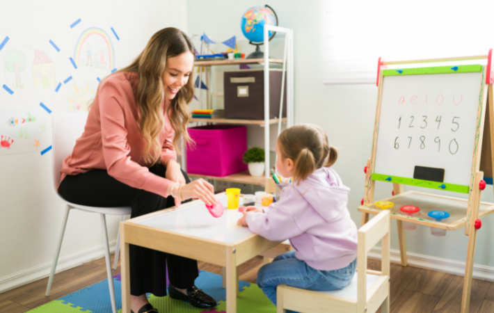 A therapist works with a young child