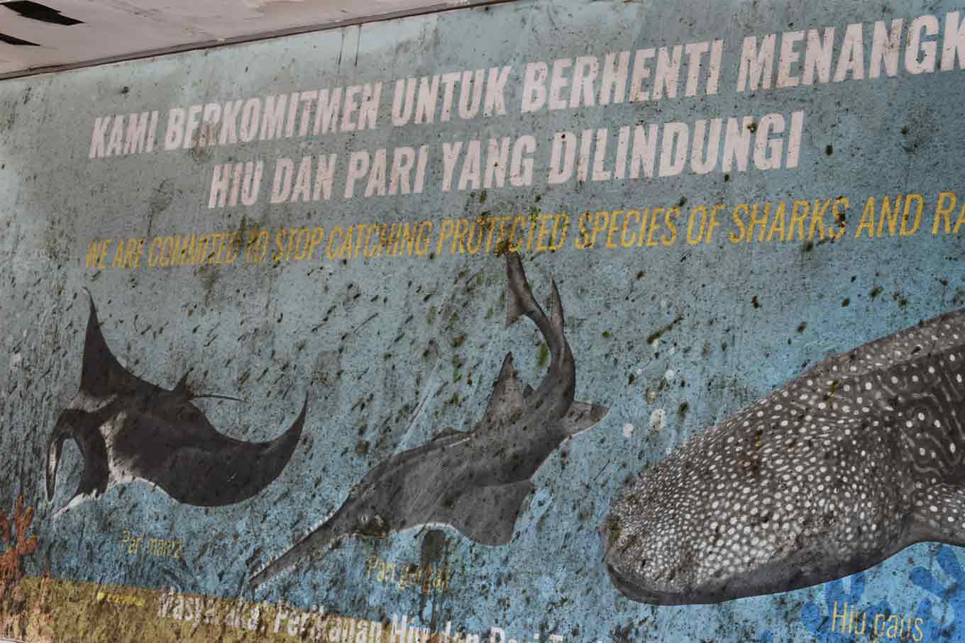 Sign at the Tanjung Luar fish market.