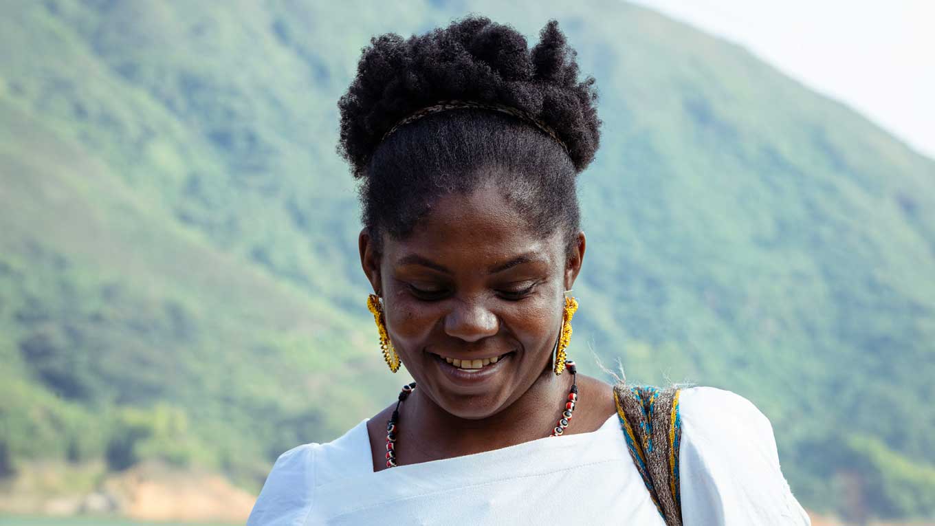 A still from "Igualada" showing Francia Marquez looking down and smiling