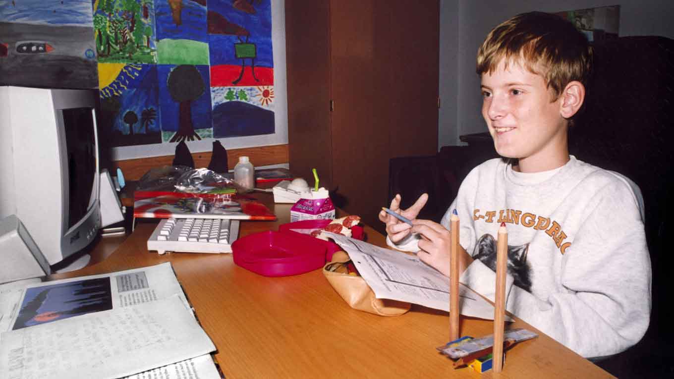 A still from "Ibelin" of Mats Steen playing games at his desk