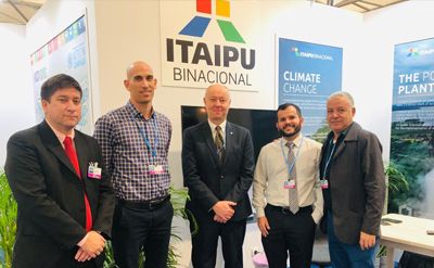 IHA's Chief Excutive Richard Taylor (centre) with representatives of Itaipu Binacional at COP24.