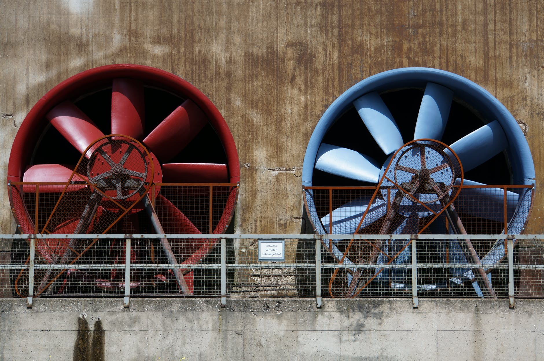 Industrial cooling fans in red and blue