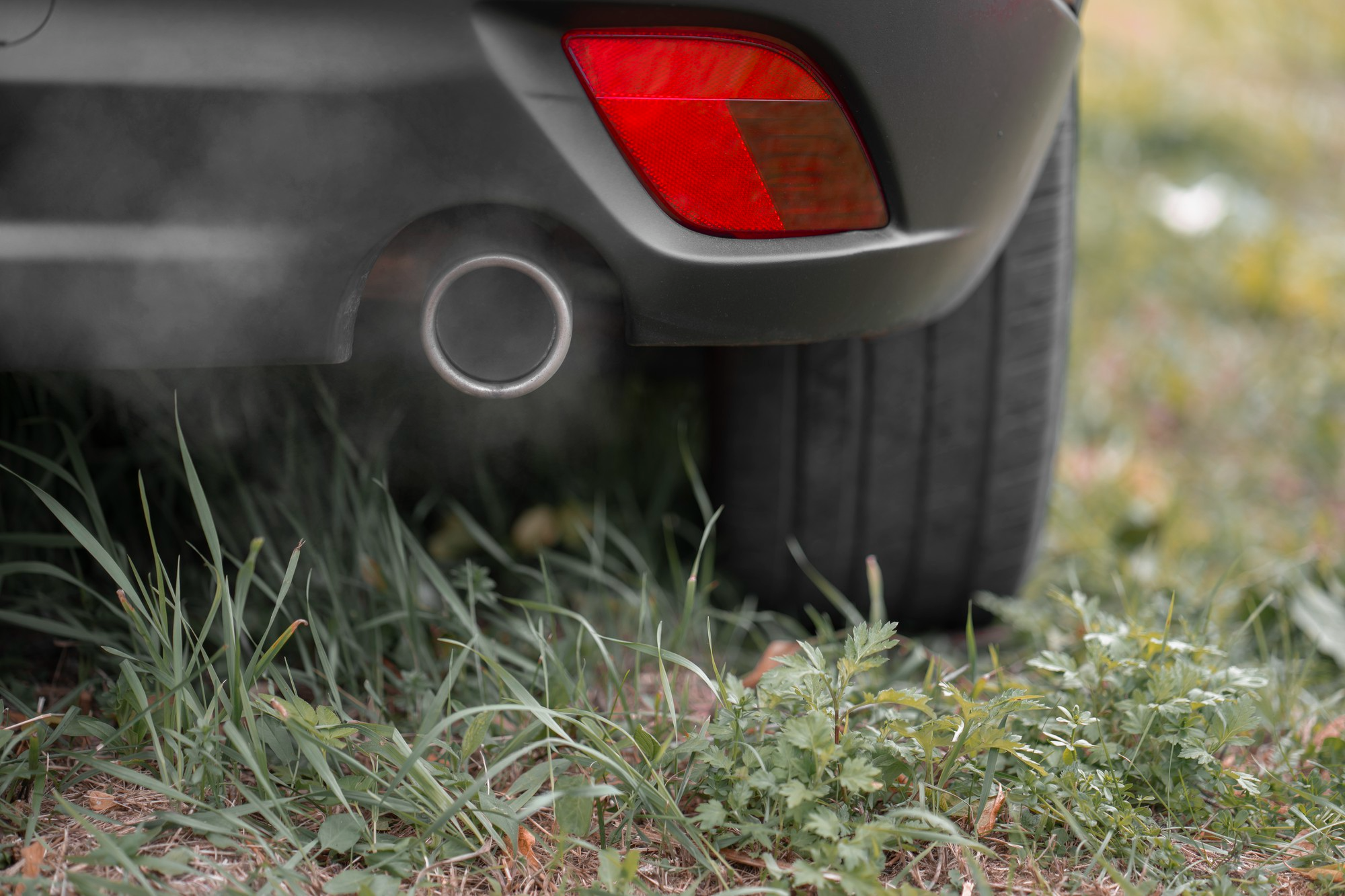 Exhaust of car emitting smoke
