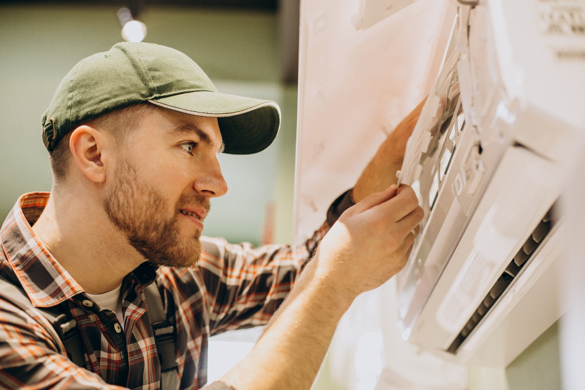 Technician fixing air conditioner