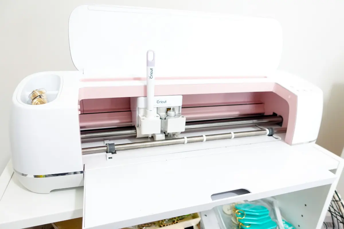 A Cricut cutting machine in pink.