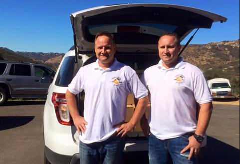 Pearson Brothers Michael and Dale with wine cases in trunk
