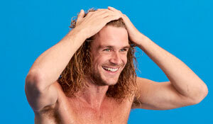 A man holding his hair back