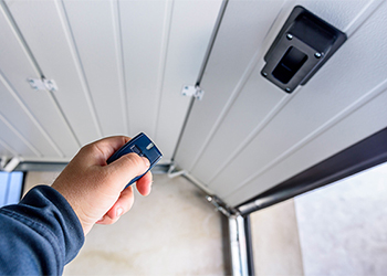 Pointing a remote control at a garage door