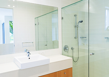 Bathroom featuring glass mirror