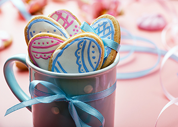 Mug containing Easter biscuits