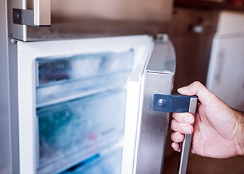 Man opening freezer door