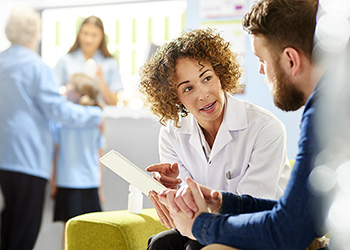 Pharmacist giving advice to a customer