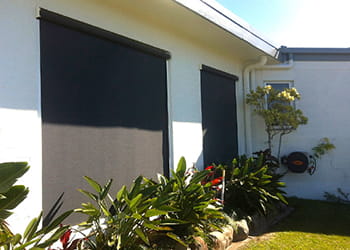 Window with outdoor blinds to block sun