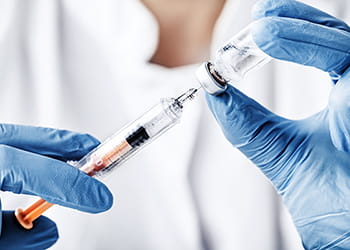 Doctor preparing vaccine