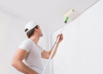 painter painting a ceiling