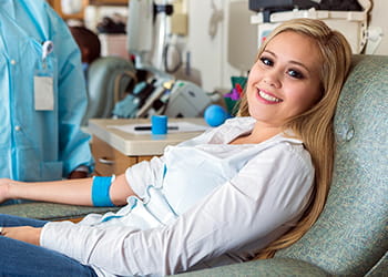 Young lady making a blood donation
