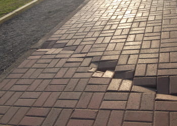 Sinking brick pavers