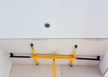 Plasterboard attached under existing ceiling