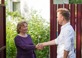 Young man meeting a neighbour