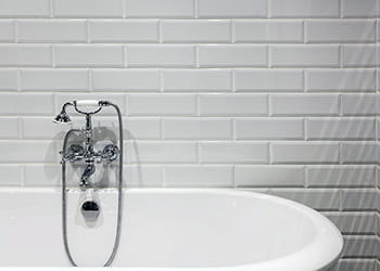 bath against white subway tiles