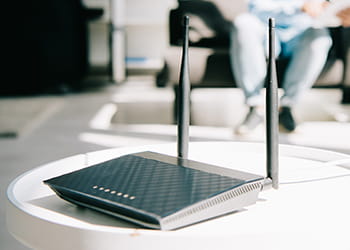 Wi-Fi router on a table in the middle of a room