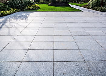 grey pavers in a landscaped garden
