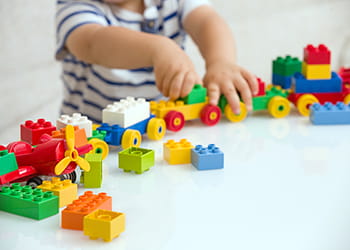 Child playing with colourful blocks