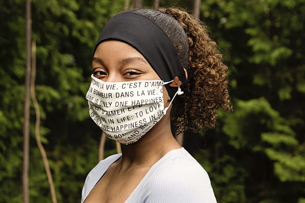woman wearing a face mask and a head band
