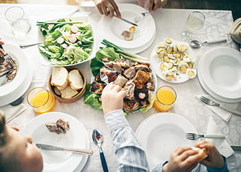 top-view-of-family-dinner-of-chicken-and-salad