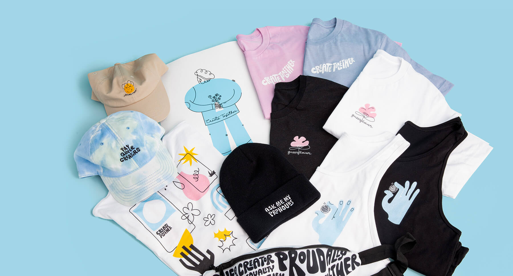 A pink t-shirt with a black and white tank top and a blue tie die hat laying on top of a light blue background