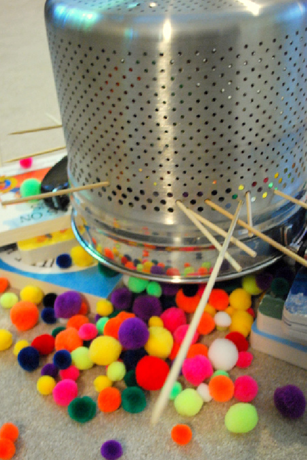 Picture of a colander and pompoms