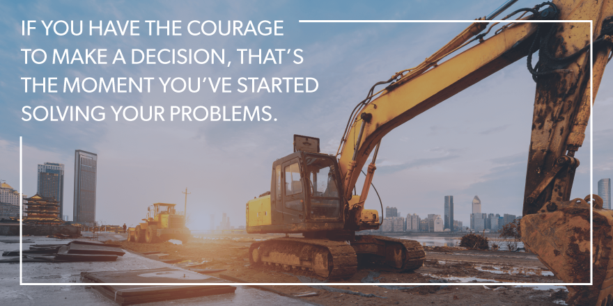 An image of a bulldozer with "If you have the courage to make a decision, that's the moment you've started solving your problems" overlying the image.