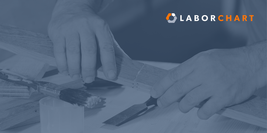 A picture of hands gluing a piece of wood together with the LaborChart logo in the upper right hand corner.