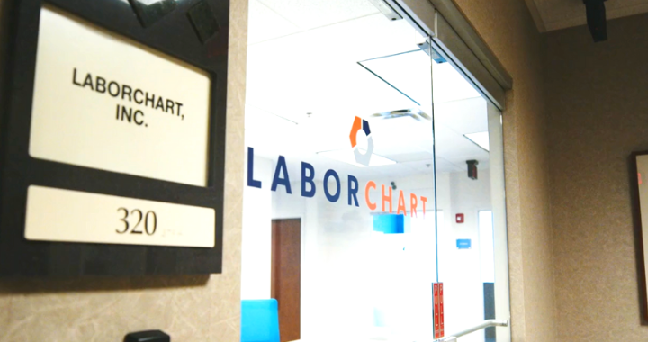 An image of the LaborChart logo on the door at the LaborChart overland park office.