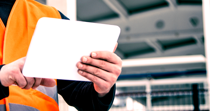 Construction worker on a tablet.