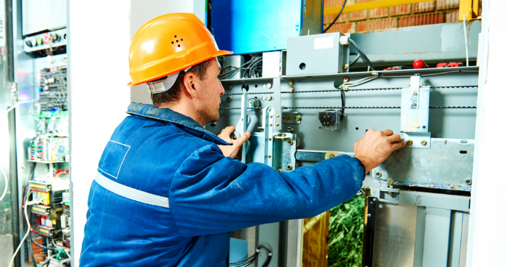 An electrical contractor working on electrical wires.