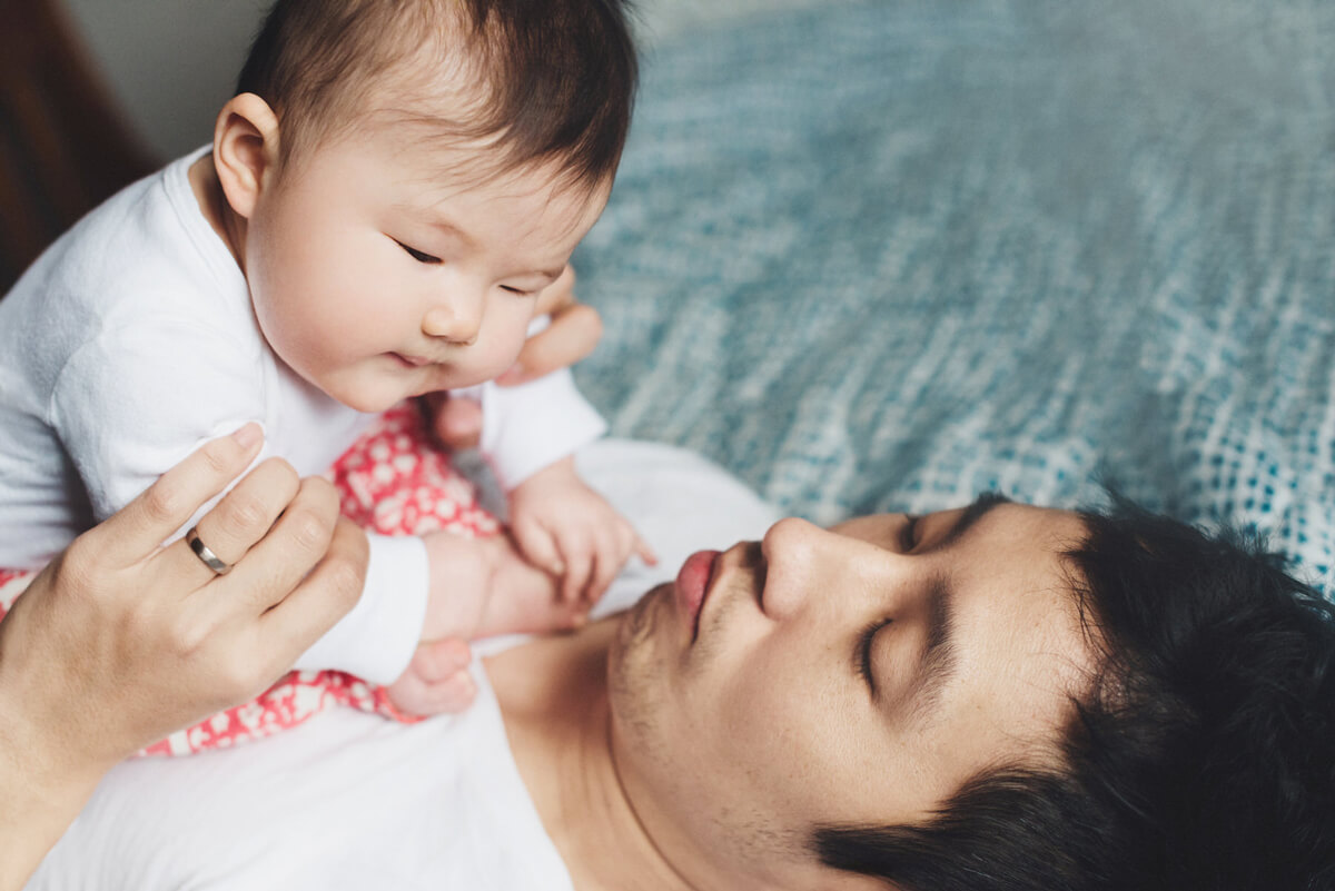 father with kid in the chest