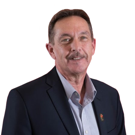 A smiling, mature man with short brown hair and a mustache. He sports a black suit jacket and a gray button up shirt with no tie.