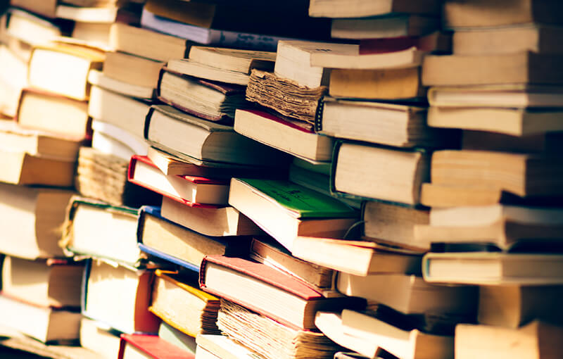 Multiple stacks of books.