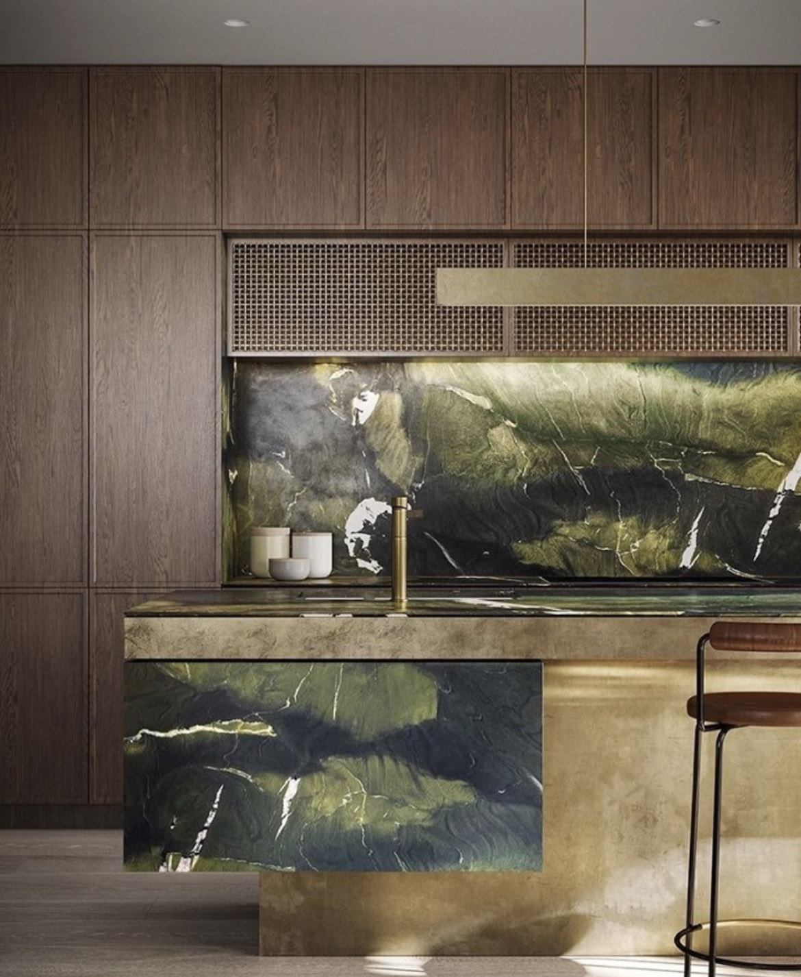 The image shows a luxury kitchen interiors with brass details and green marble countertops. The image clicks through to a kitchen interiors trend 2022. The interiors on the image are designed by Luigi Roselli.