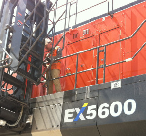 Image of worker on a Hitachi EX5600.