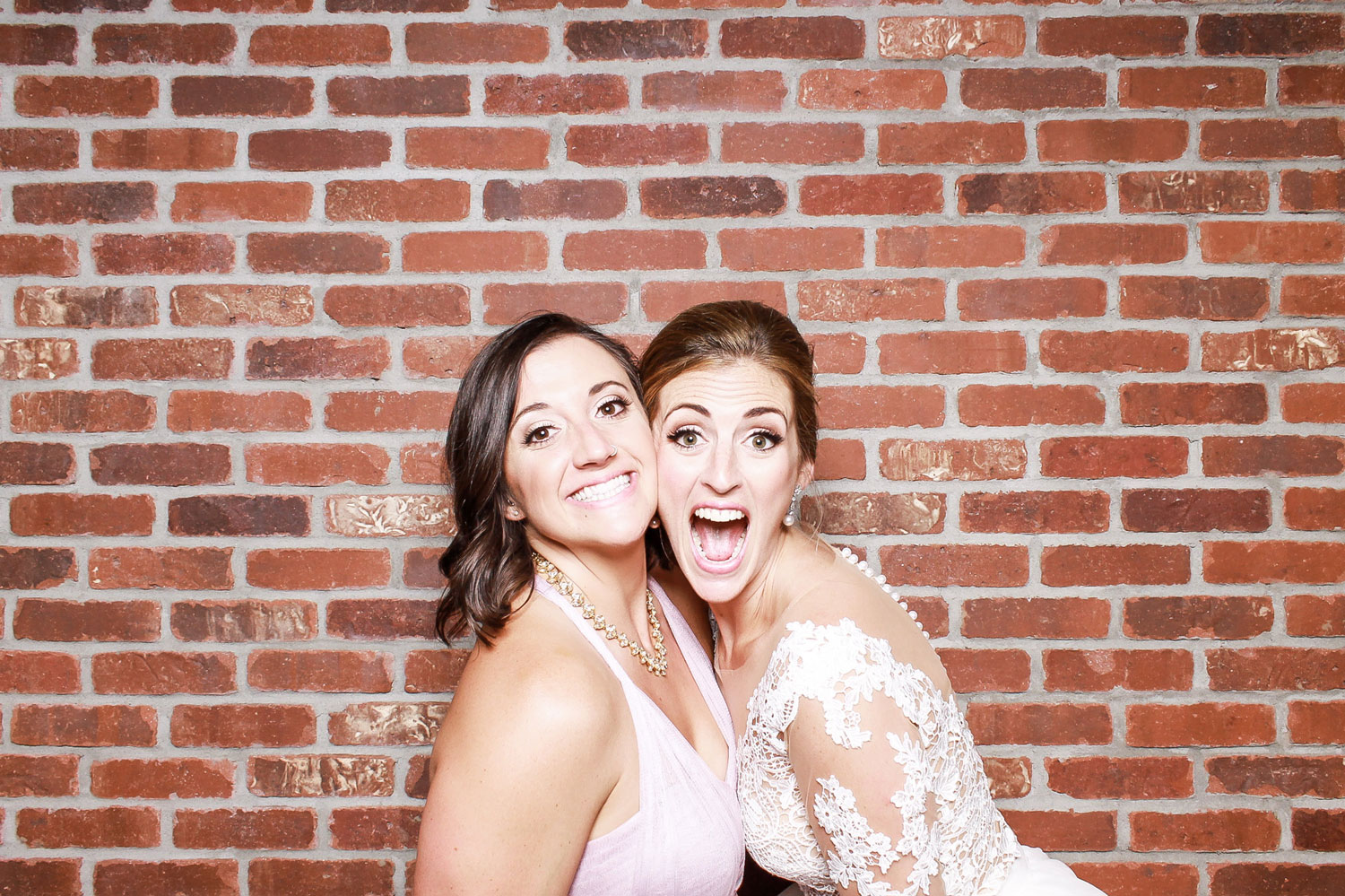 open photo booth brick background