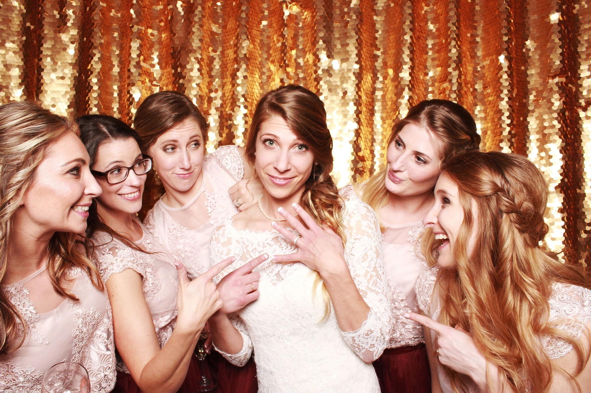 Bridesmaids and wedding party in a photo booth