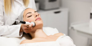 Woman getting facial treatment at Beverly Hills Rejuvenation Center