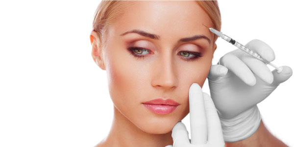 Woman getting an injection in her eyebrow