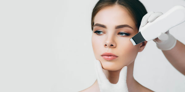 Woman receiving ultherapy treatment on her face