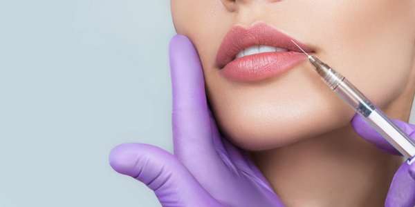 women getting lip injections.