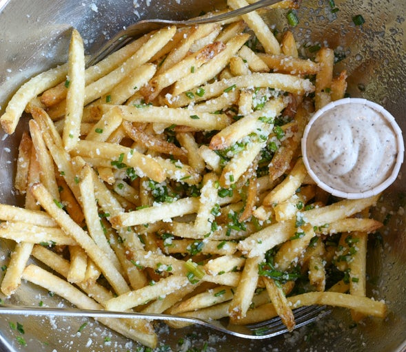 Bowl of Hopdoddy parmesan truffle fries with truffle aioli